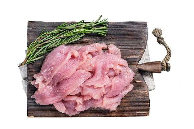 Sliced Raw turkey or chicken fillet meat on a cutting board with butcher knife Isolated white background