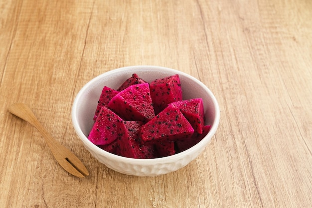 Sliced Red Dragon Fruit ( Buah Naga Potong) served in a bowl