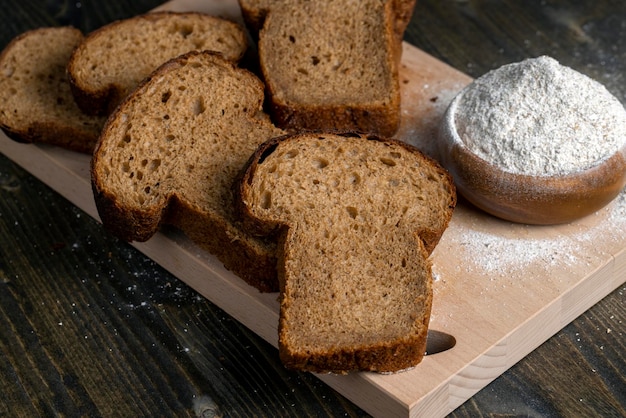 Sliced rye bread on a wooden table close up