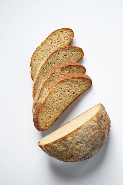 Sliced rye eco bread on a gray background Minimalist composition