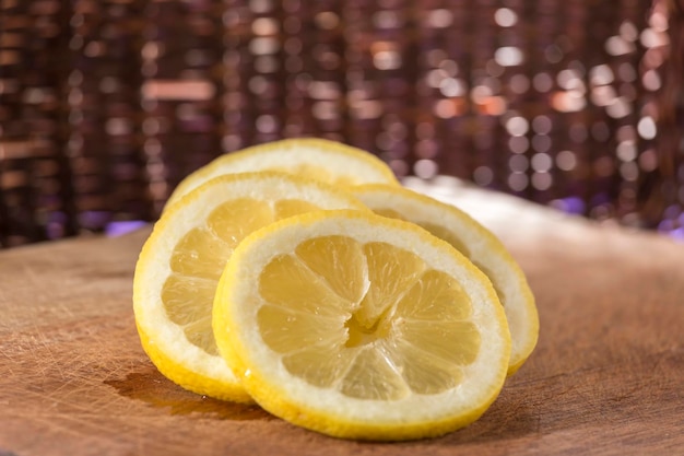 Sliced split lemon on a wooden board commercial background