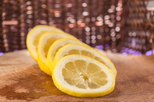 Sliced split lemon on a wooden board commercial background