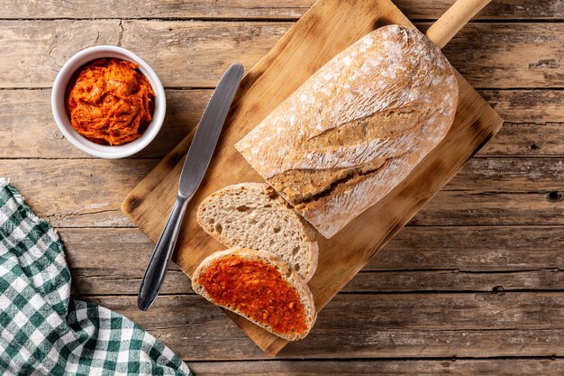 Sliced toast bread with sobrasada on rustic wooden table