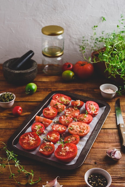 Sliced Tomatoes with Thyme and Garlic on Baking Dish