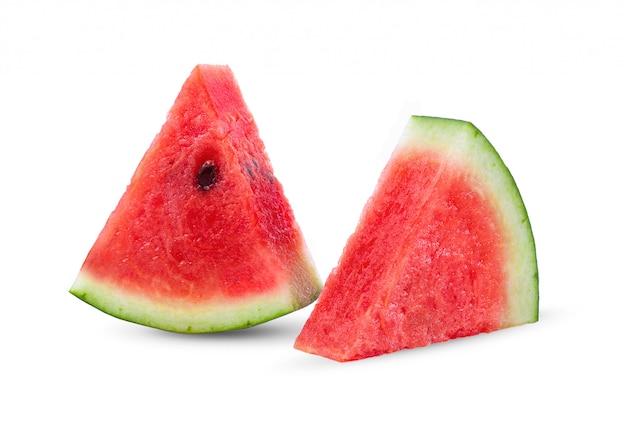 Sliced watermelon on white wall.