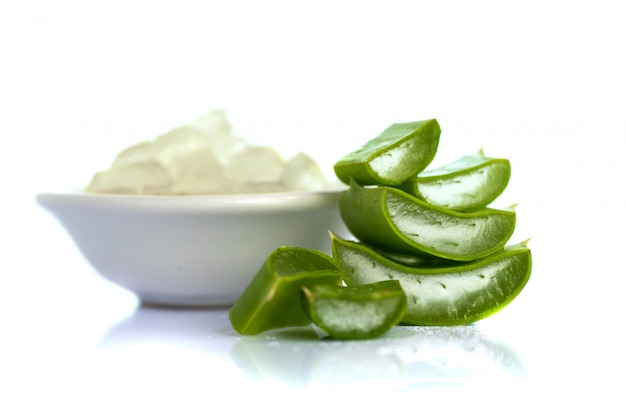 Slices of Aloe Vera leaves and Aloe Vera gel . Aloe Vera is a very useful herbal medicine for skincare and hair care.