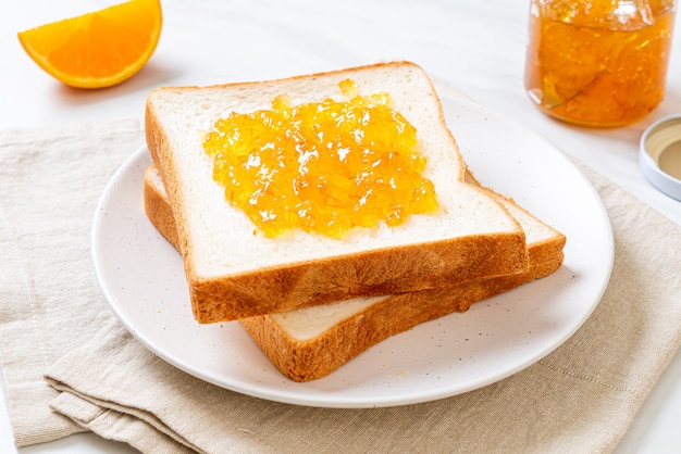 Slices of bread with orange jam