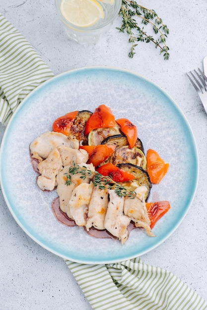 Slices of chiken and vegetables beautifully plated