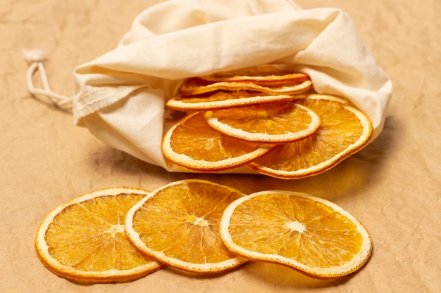 Slices of dried orange in a fabric bag Close up