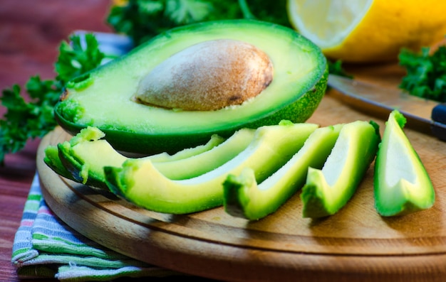 Slices of fresh avocado on a cutting board