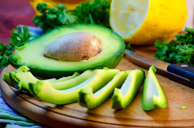 Slices of fresh avocado on a cutting board