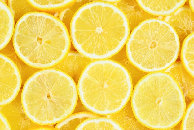 Slices of fresh ripe lemons top view