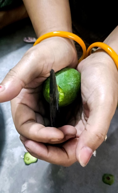 Slices of green mango with raw mango for picklingAsian cuisine