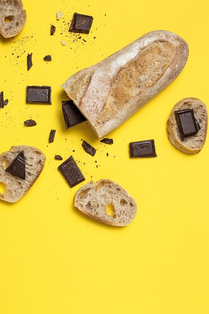 Slices of Homemade Seed Bread with a chocolate bar from above