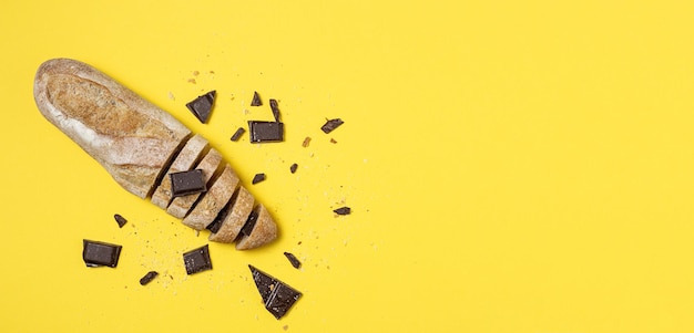 Slices of Homemade Seed Bread with a chocolate bar from above