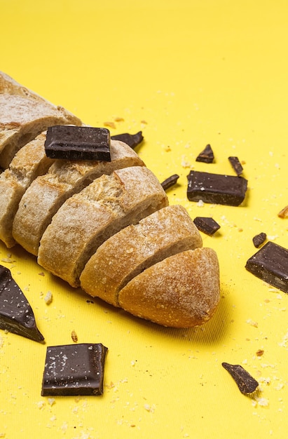 Slices of Homemade Seed Bread with a chocolate bar from above