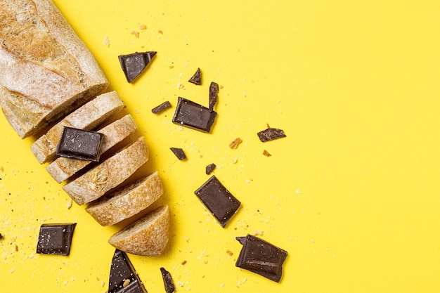 Slices of Homemade Seed Bread with a chocolate bar from above