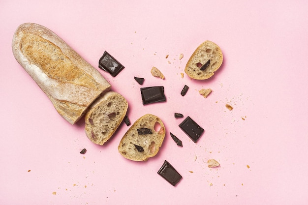 Slices of Homemade Seed Bread with a chocolate bar from above