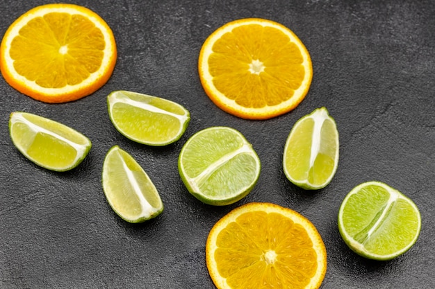 Slices of orange and lime on the table