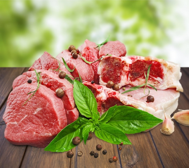 Slices of raw meat with spices