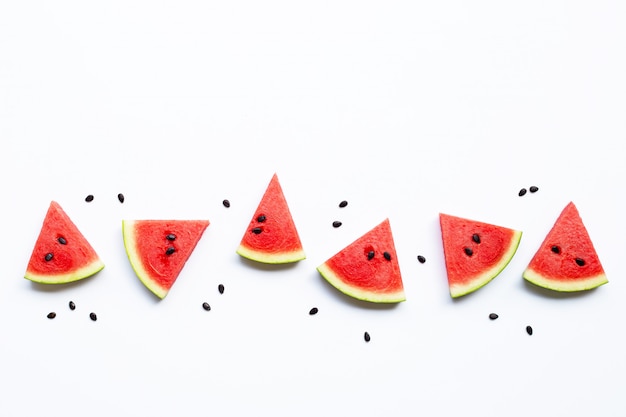 Slices of watermelon with seeds isolated on white 