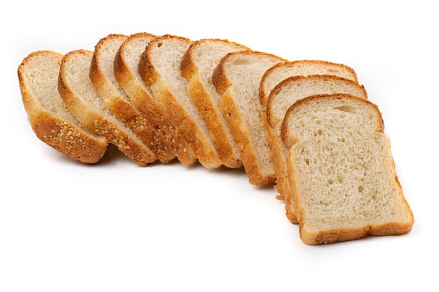 Slices of white bread or a loaf with sesame seeds isolated on a white background.