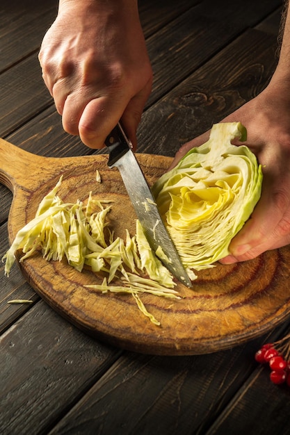 Slicing cabbage on a cutting board