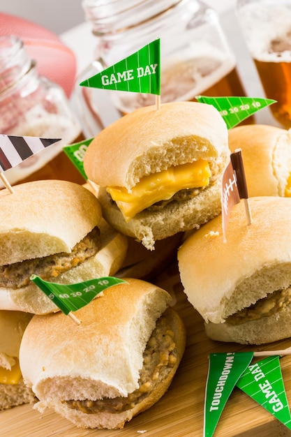 Sliders with veggie tray on the table for the football party.