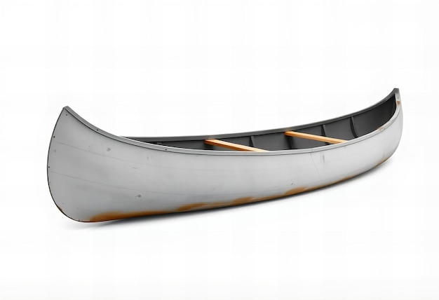 Photo slight angled view of an old gray canoe with no people isolated on a white background