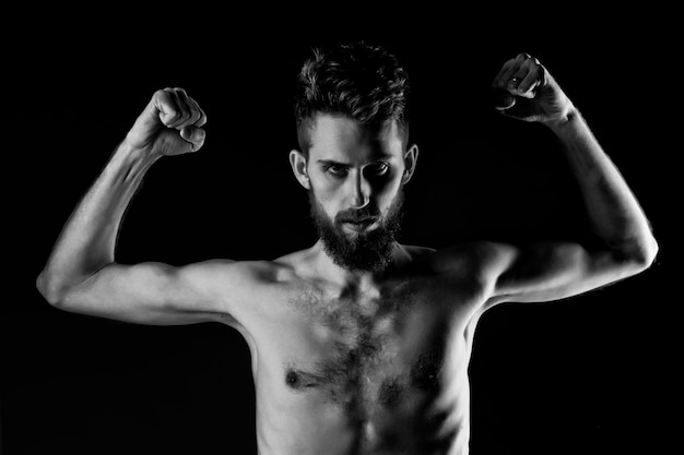 Slim man. Hipster guy dieting with serious face and bare slim or thin body, chest and torso with anorexia isolated on black background.