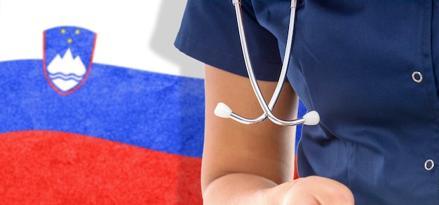 Slovenia flag female doctor with stethoscope, national healthcare system