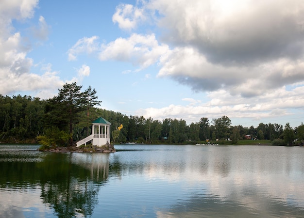 small beautiful island on Lake Aya There is small gazebo on the island and a forest around the lake