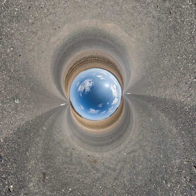 Small blue planet surrounded by concrete