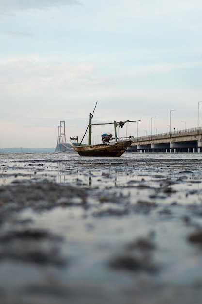 Small Boat Under A Long Bridge Suramadu