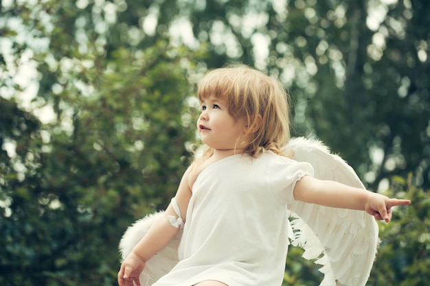 Small boy in angel wings