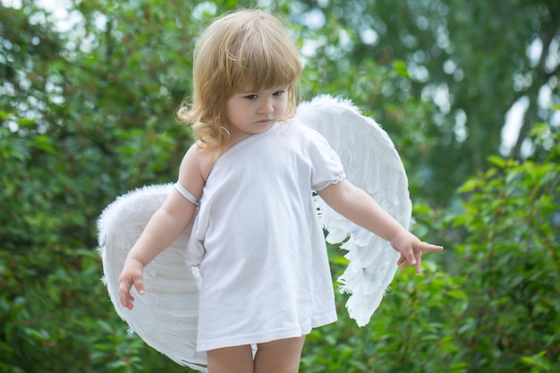 Small boy in angel wings