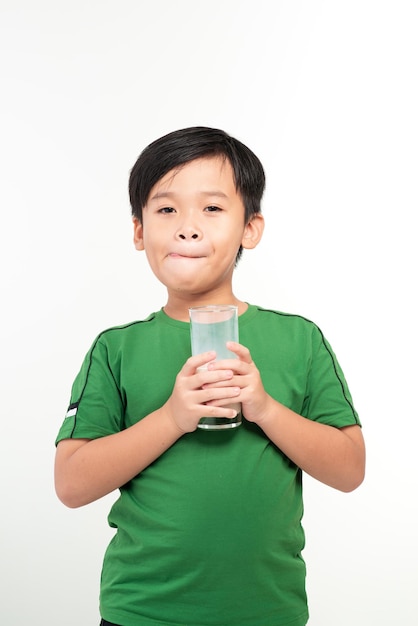 small boy drink a glass of milk with different emotions on white background