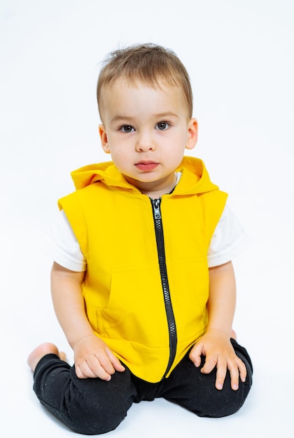 Small boy in studio Portrait of cute funny child on white background