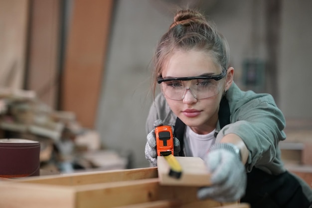 Photo small business of a young woman in furniture workshop background