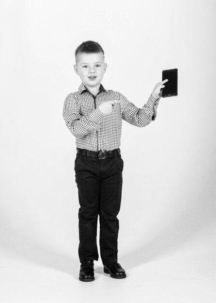 Small businessman Upbringing and development Little boy formal clothes mobile phone Cute boy hold smartphone Mobile technology Download application Mobile communication Modern gadget