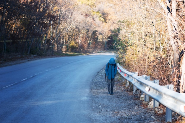 A small child walks alone along the road and cries ran away from home Family