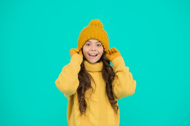 Small child wear hat gloves sweater Climate control Cold weather Cute girl enjoy winter season Little kid wear knitted hat Carefree childhood Winter vacation Clothes shop Winter collection