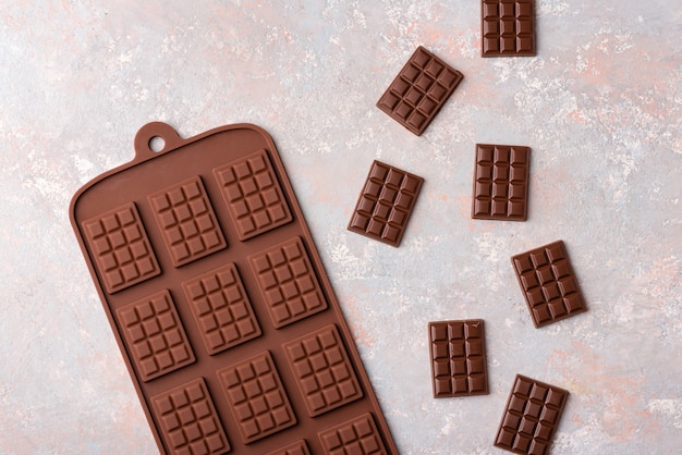 Small chocolate bars on a light background