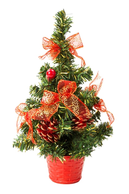 Small christmas tree with bows and cones over white background