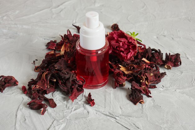 Small clear spray bottle with hibiscus petal tonic