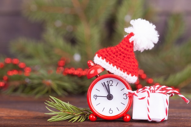 small clock in a Christmas cap. 