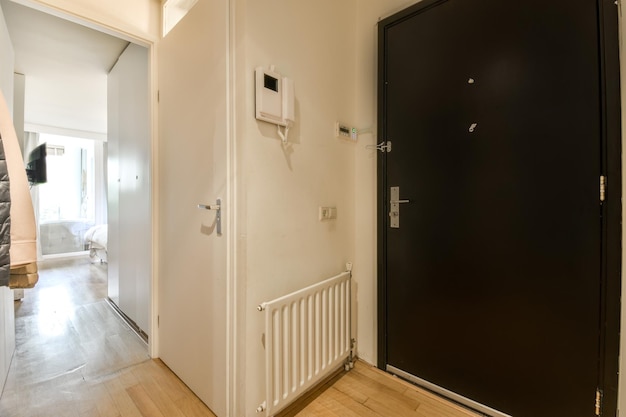 Small corridor with doors and radiator