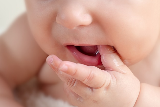 Small cute newborn baby infant teething