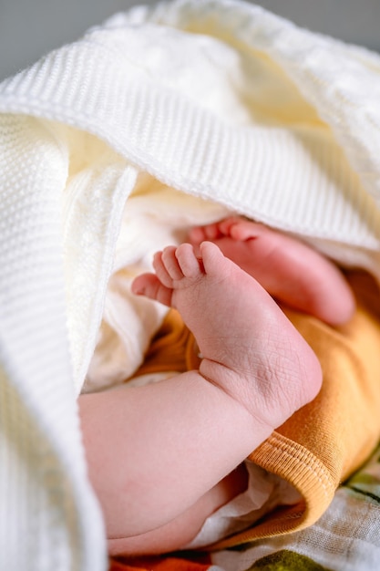 Small feet of a newborn baby