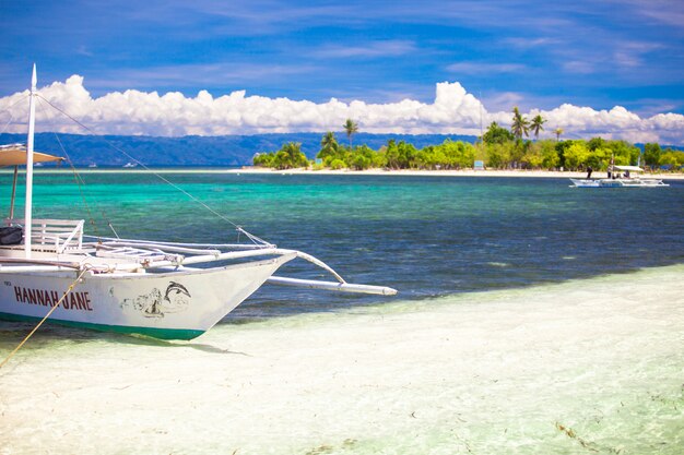 Small fishing boat in turquoise lagoon